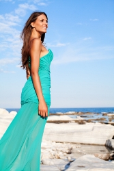 Beauty posing on the rocky coast